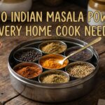 Top 10 Indian masala powders including sambar powder, garam masala, rasam powder, biryani masala, and curry powder arranged in bowls on a wooden surface.