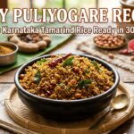 Easy Puliyogare recipe with authentic Karnataka-style tamarind rice served in a bowl, garnished with peanuts, curry leaves, and dried red chilies, ready in 30 minutes.